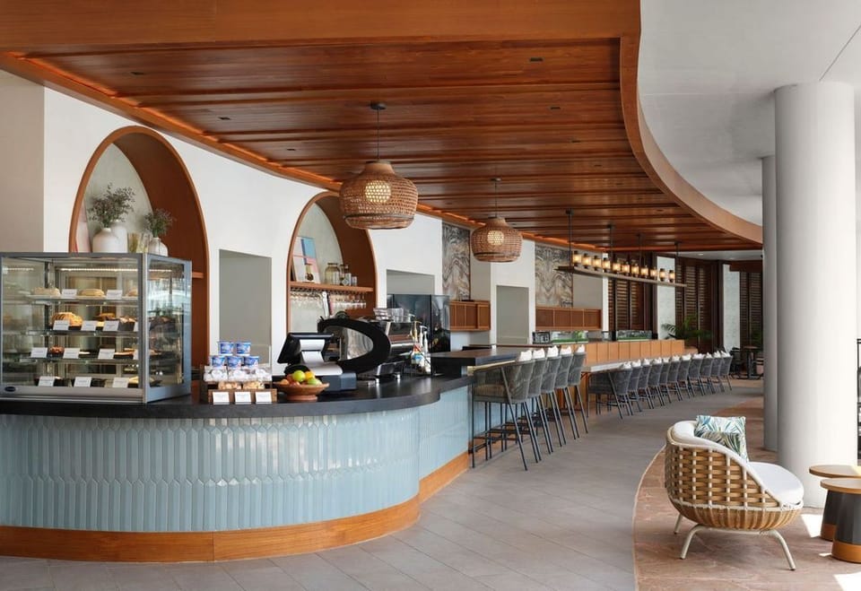 Gather at the stylish bar for bites and crafted drinks.