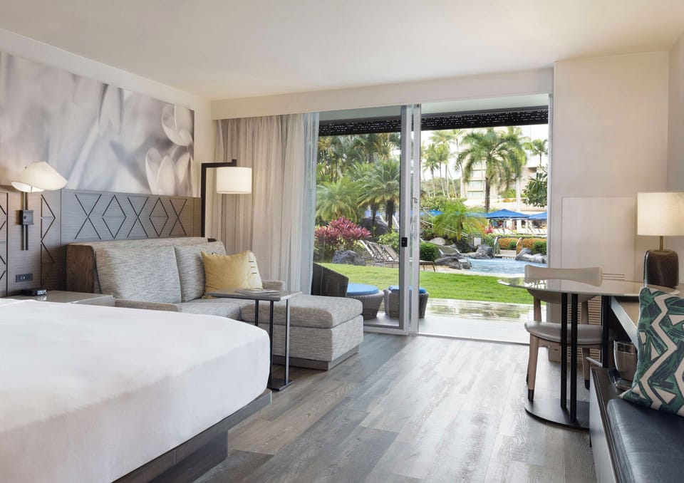 Lounge in your suite with garden views and open air.
