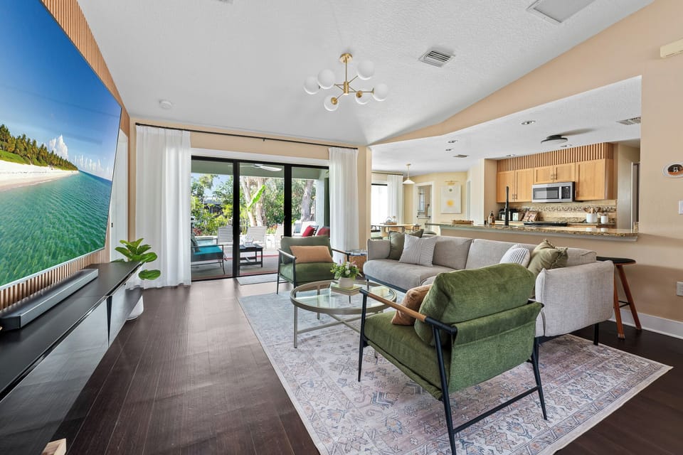 Bright, open living space with a spectacular view of the pool and patio.