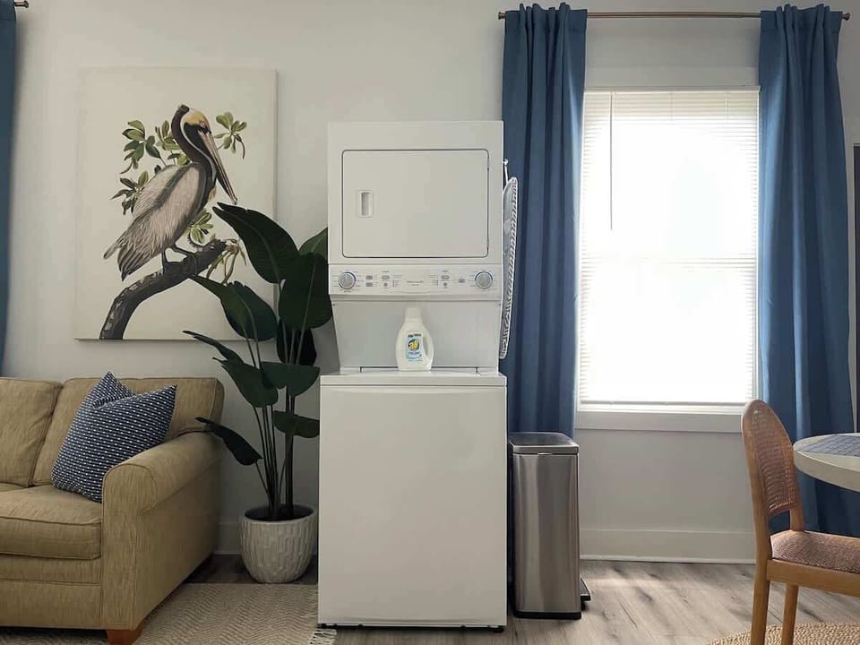 Exposed washer and dryer stack adds character… and makes laundry easy to reach! There is one laundry unit in each apartment. 