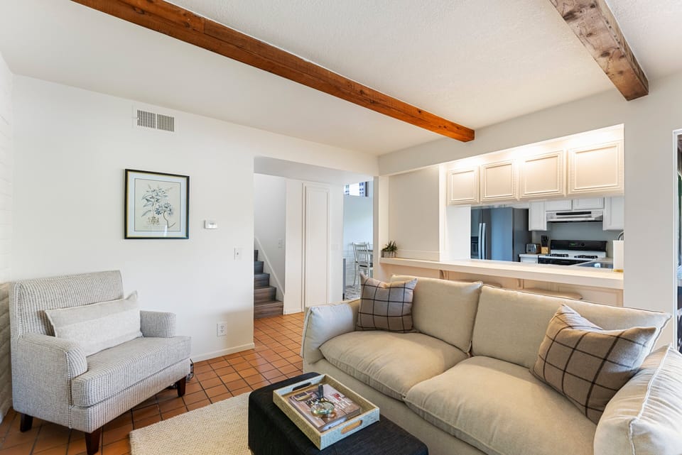 Main floor living room off of the kitchen with direct access to the back patio