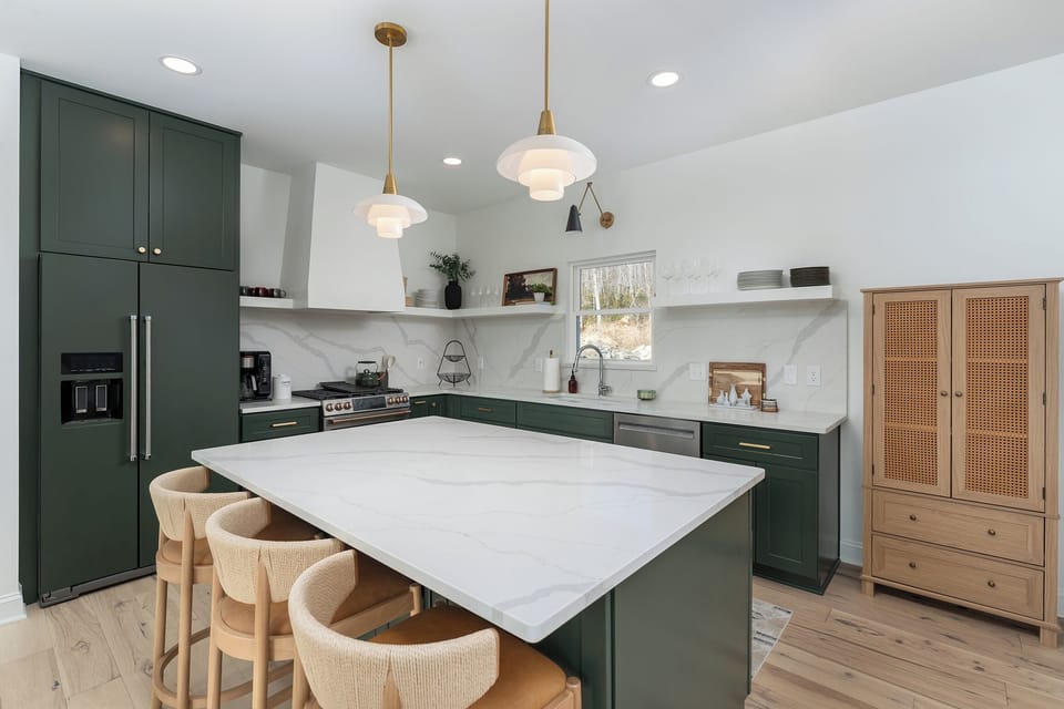 Gourmet kitchen with a gas range stove, dishwasher, island seating for 3, and 2 types of coffeemakers (Drip & Keurig).