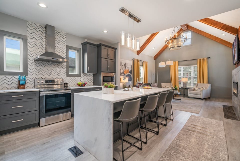 Modern kitchen with sleek countertops, stainless steel appliances, and a spacious island—ready for meals and memories!