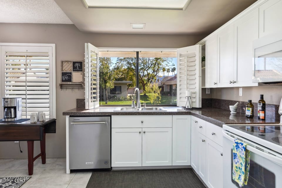Kitchen with Coffee with generous Countertop Space and Stove