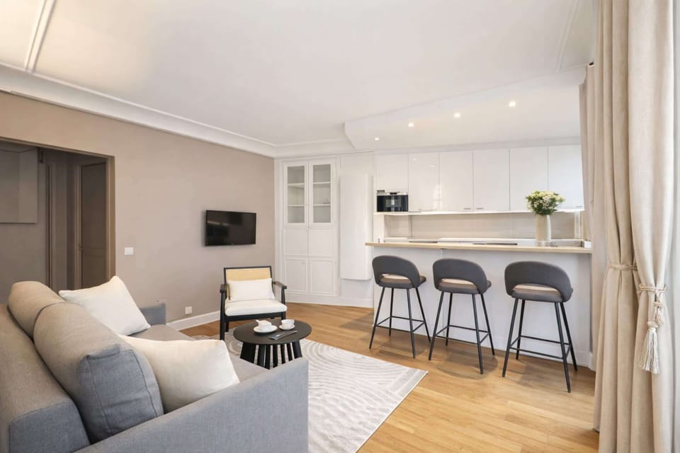 Prepare meals in this open-concept kitchen, leading to a relaxing TV lounge