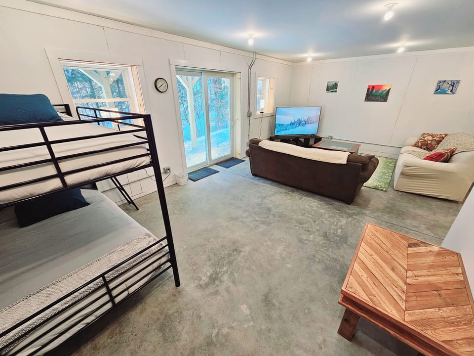 Finished basement  with queen/single bunk and single/single bunk