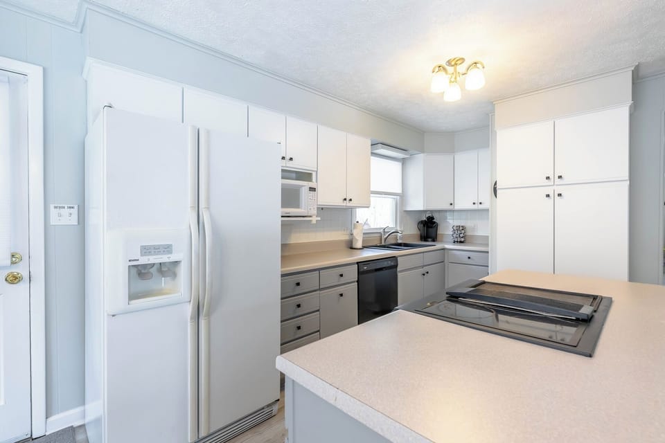 Modern kitchen with ample storage, updated appliances, and a spacious layout for cooking and entertaining