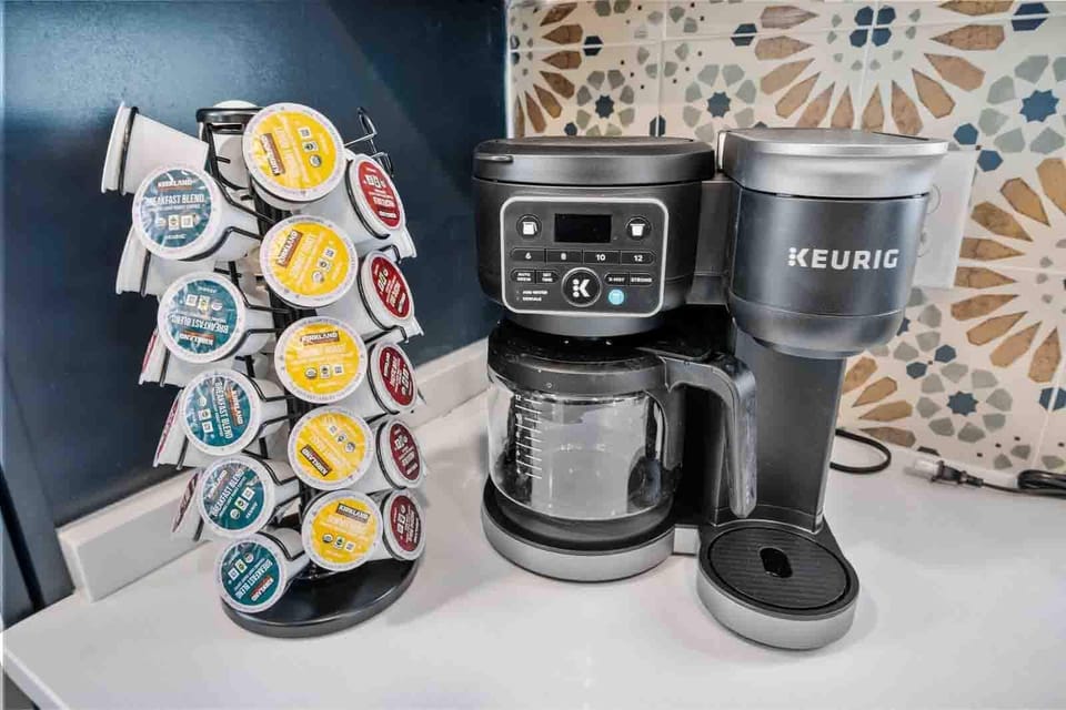 Start your mornings with our Keurig 2-in-1 coffee maker, offering both drip coffee and K-Cup options. Choose from breakfast blend, summit roast, or dark roast, and enhance your coffee with French vanilla, caramel, or regular creamer (not pictured) for the perfect cup.