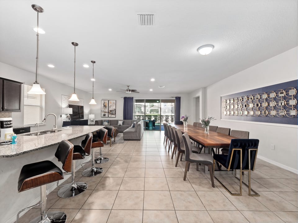 Spacious Downstairs Living Area with Full Size Kitchen, Dining Table and Comfortable Lounge