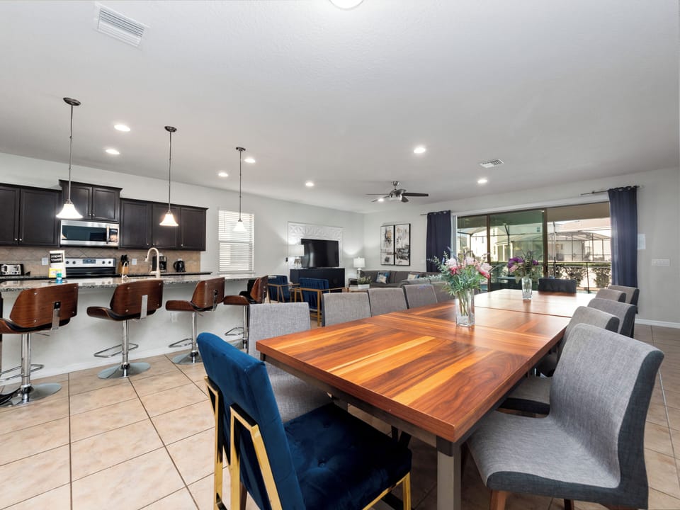 Spacious Downstairs Living Area with Full Size Kitchen, Dining Table and Comfortable Lounge