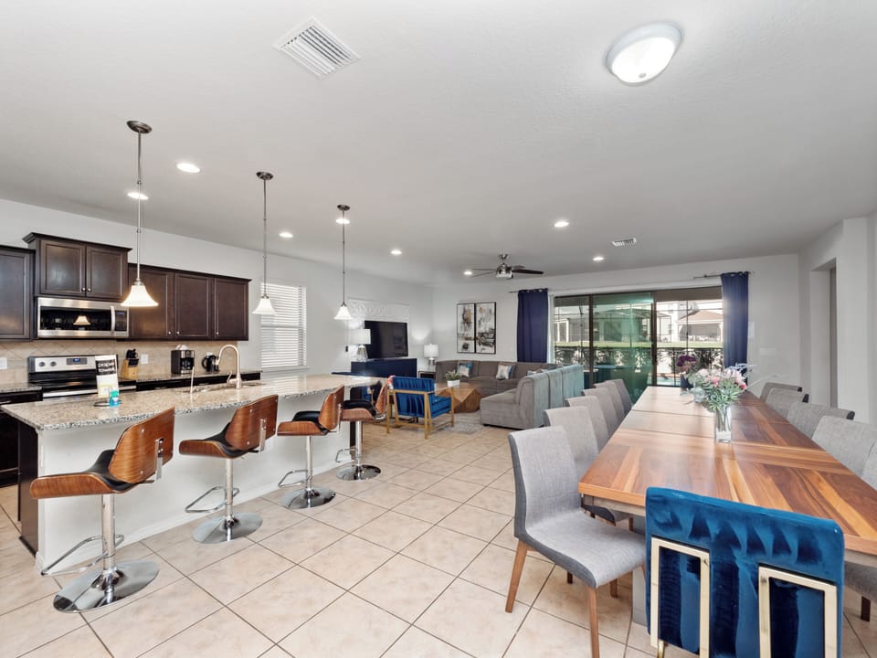 Spacious Downstairs Living Area with Full Size Kitchen, Dining Table and Comfortable Lounge