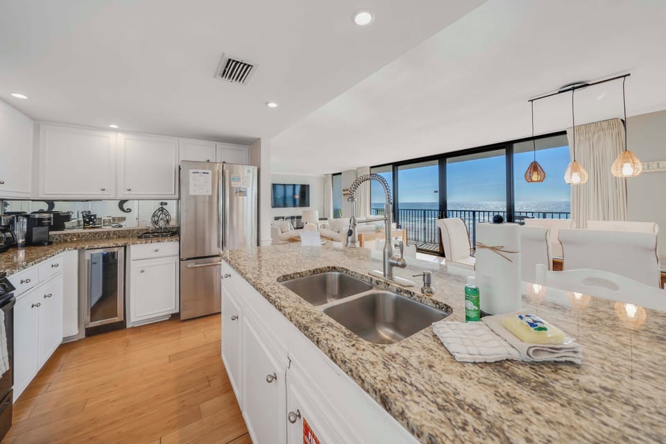 The fully equipped kitchen features granite countertops, mostly all stainless-steel appliances, and has everything you need to prepare meals for family & friends.