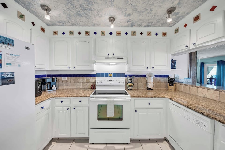 The fully equipped kitchen features granite countertops and has everything you need to prepare meals for family & friends.