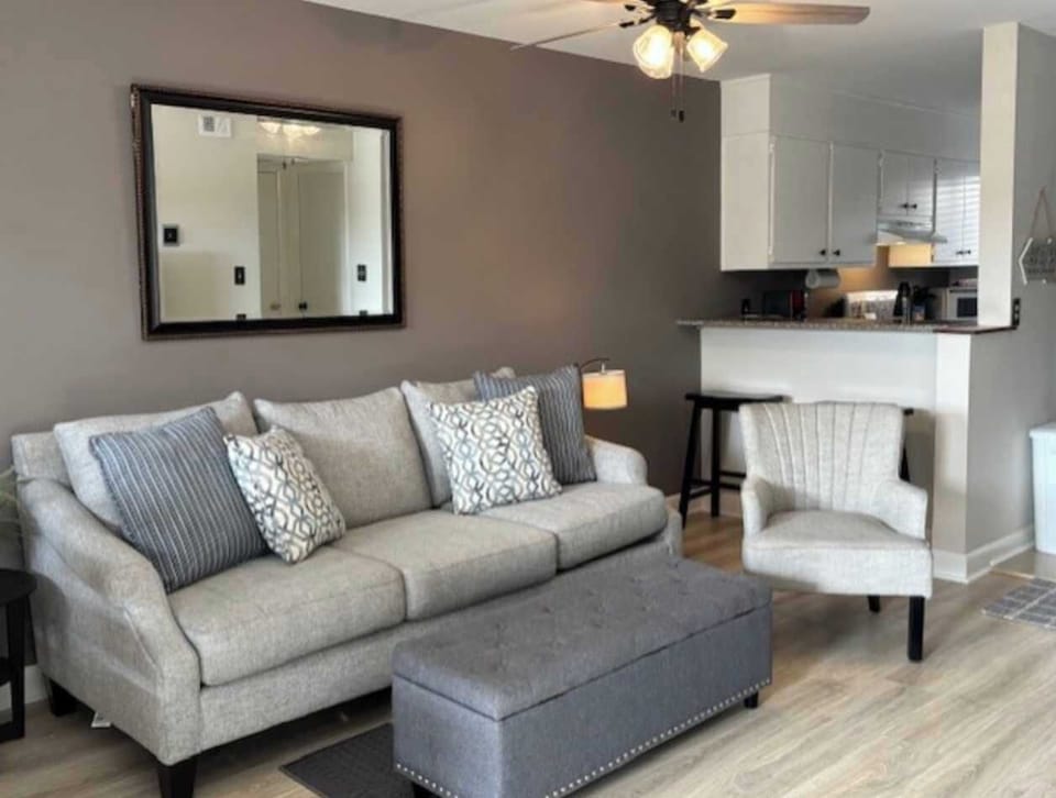 Living room w/ smart TV, balcony access