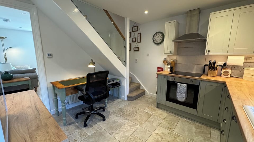 Full Kitchen with view to living room and staircase