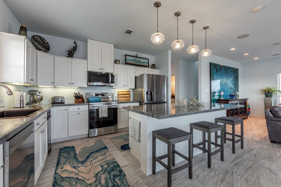 The kitchen has ample counter space & any appliance/utensil you might need. 