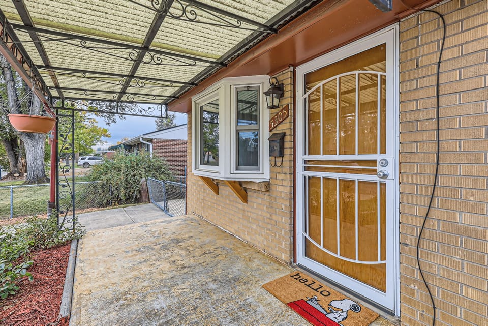 Front door with security door and ring camera