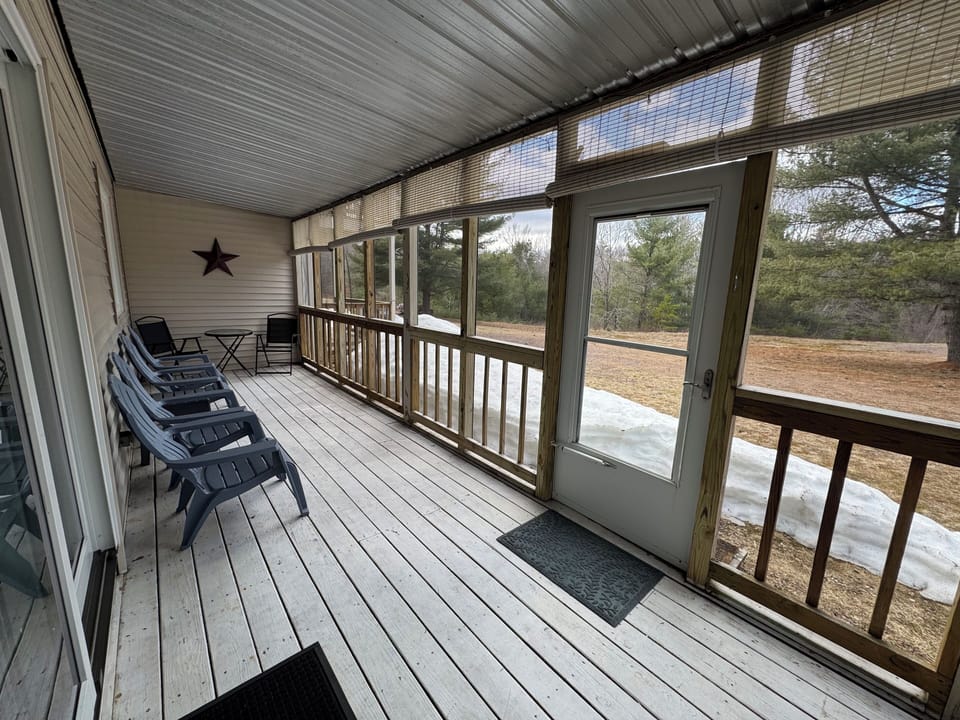 Back porch.  Chairs and small dinette table with chairs