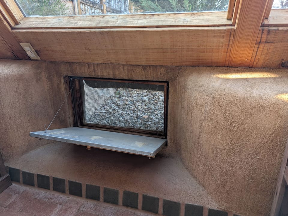 Earthship features like floor vents keep the house naturally ventilated and cool