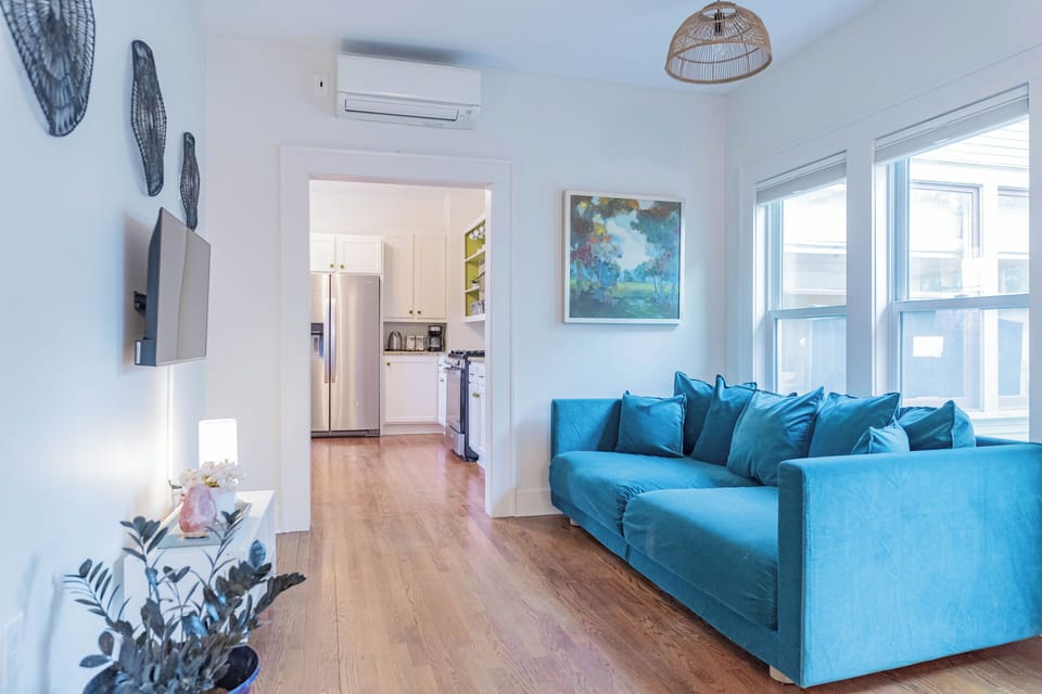 Private TV and couch for the primary bedroom. The couch can serve as a twin bed