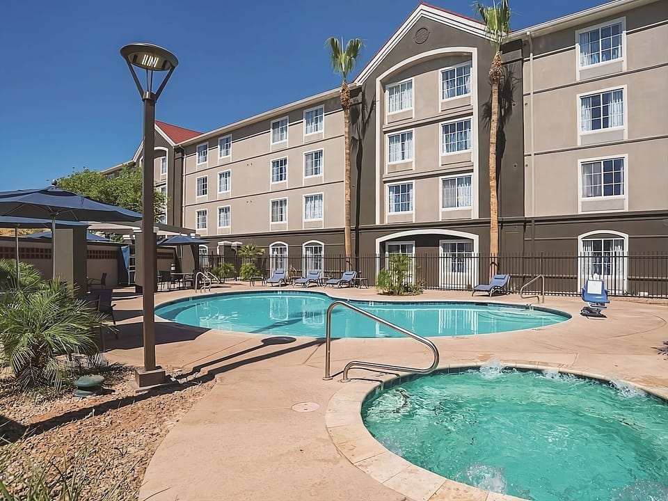 Slip into the bubbling hot tub beside the sunny pool.