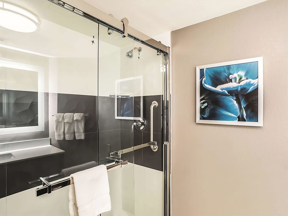 Refresh under the sleek glass shower after a long day