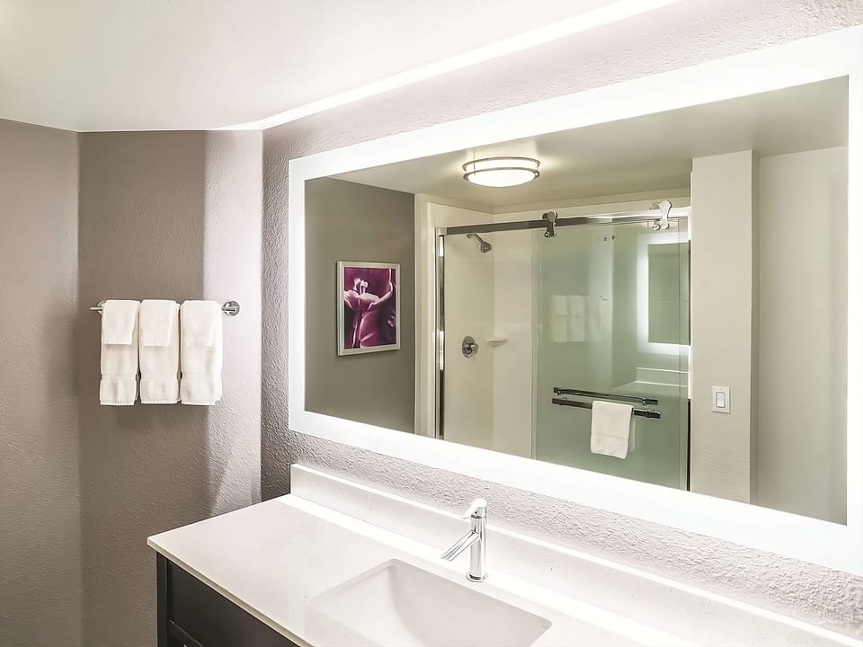 Refresh at the bright vanity with a spa-like mirror glow.