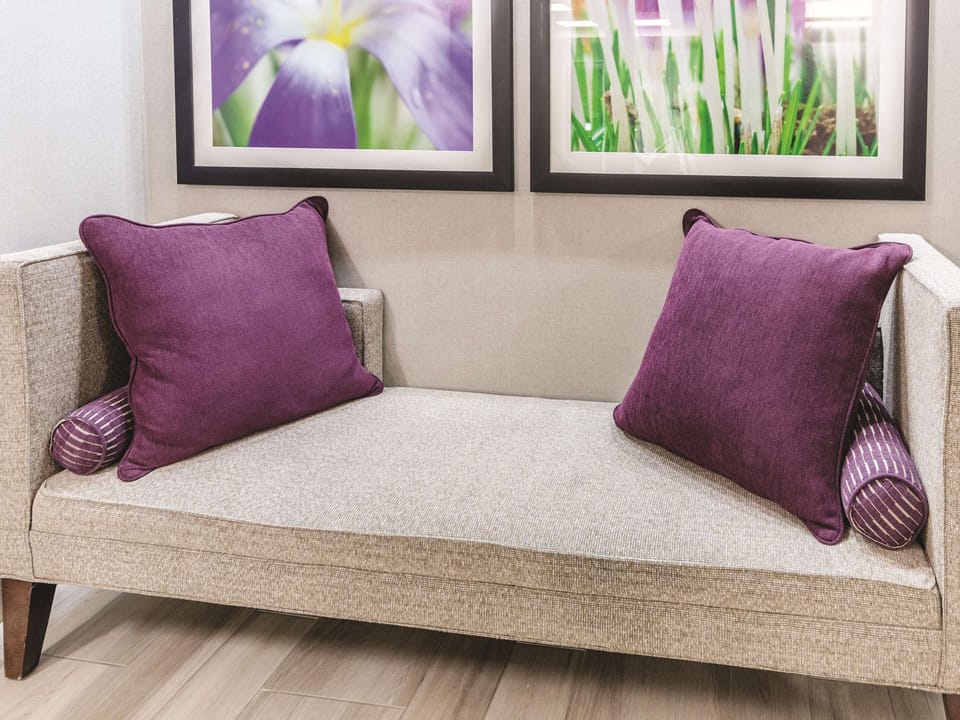Relax on plush seating with calming art and soft textures.