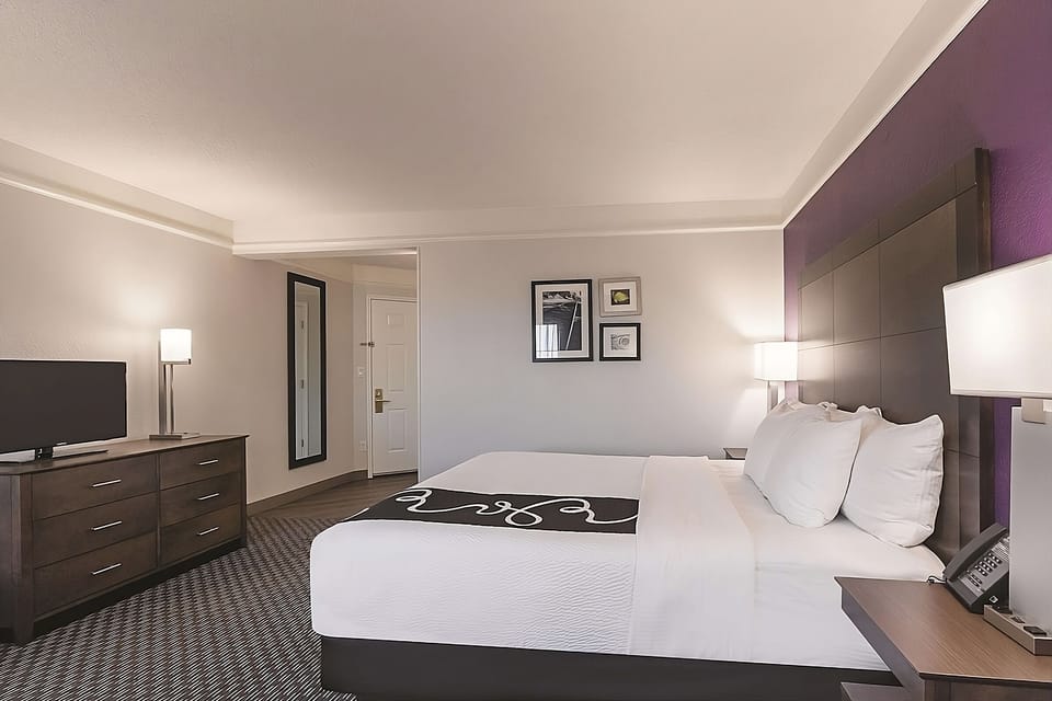 Recharge in a serene king room with plenty of space.