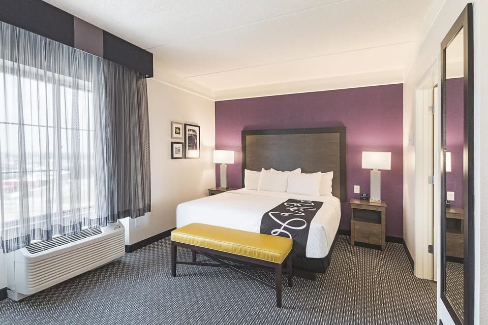 Sink into crisp linens and relax in this inviting bedroom.