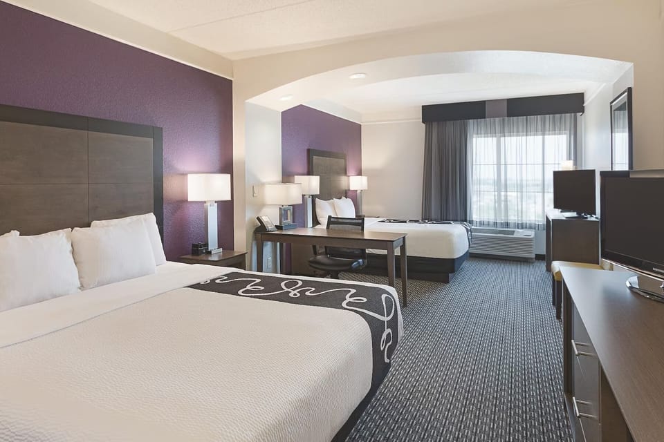 Stretch out in a spacious room with natural light and calm tones.