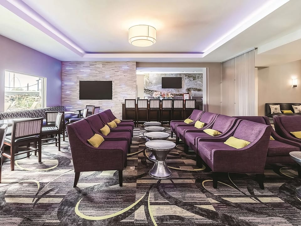 Lounge together on stylish sofas steps from the bar.