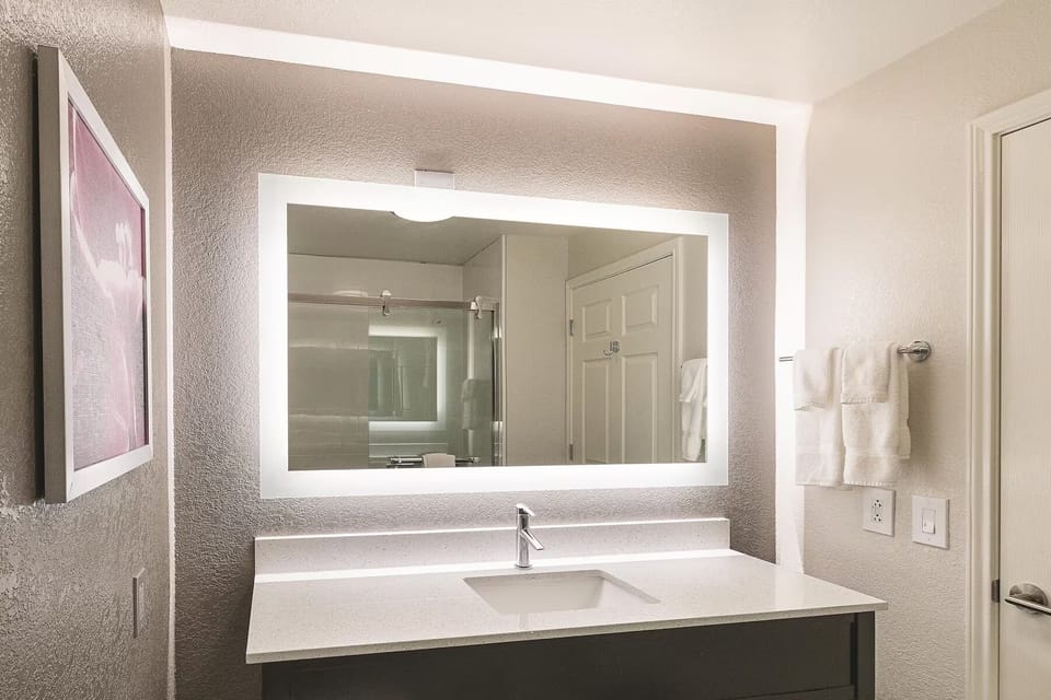 Focus with an ergonomic workspace and convenient in-room refreshments.