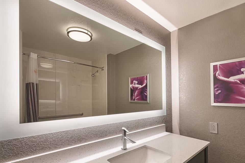 Refresh each morning at a bright vanity with glowing mirror.