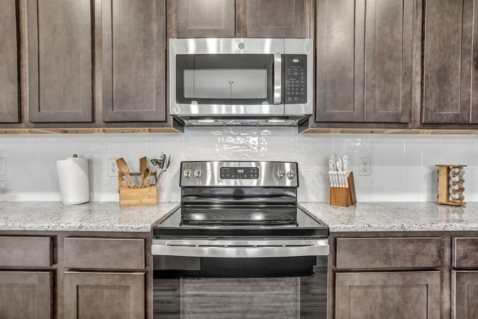 Modern appliances thoughtfully integrated into a refined kitchen design.