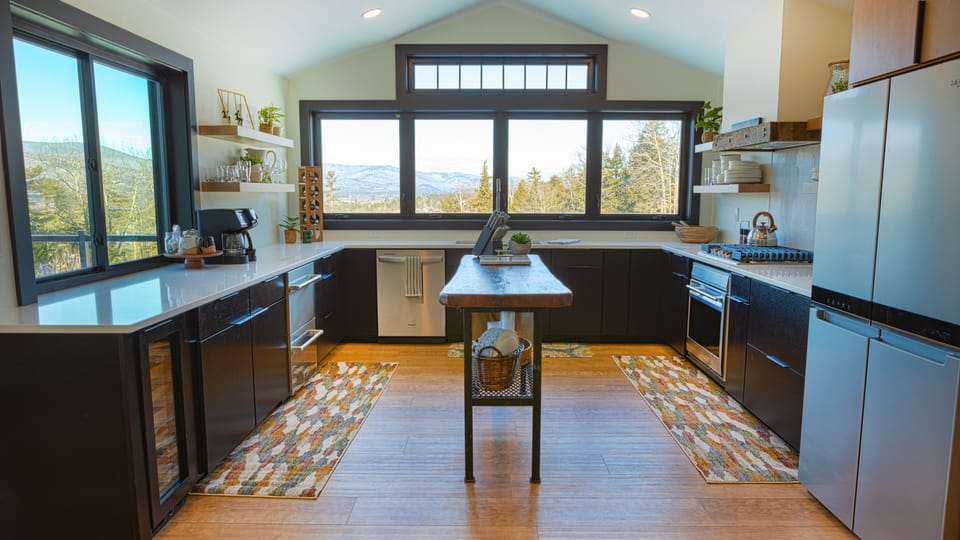 Fully stocked kitchen with views of the mountains and golf course.