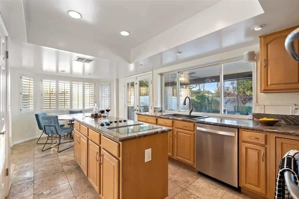 The fully equipped modern kitchen is stocked with all culinary essentials, stainless-steel appliances and dining area.