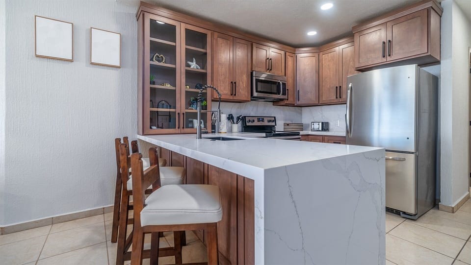 New cabinets and counters, along with all appliances in the kitchen.