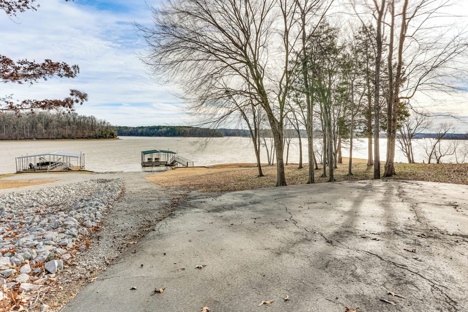 Yard Area | Private Boat Ramp | Private Dock w/ Covered Boat Slip