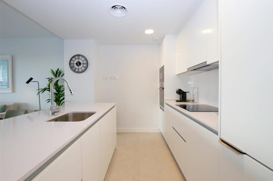 Another picture of the modern open kitchen in this property