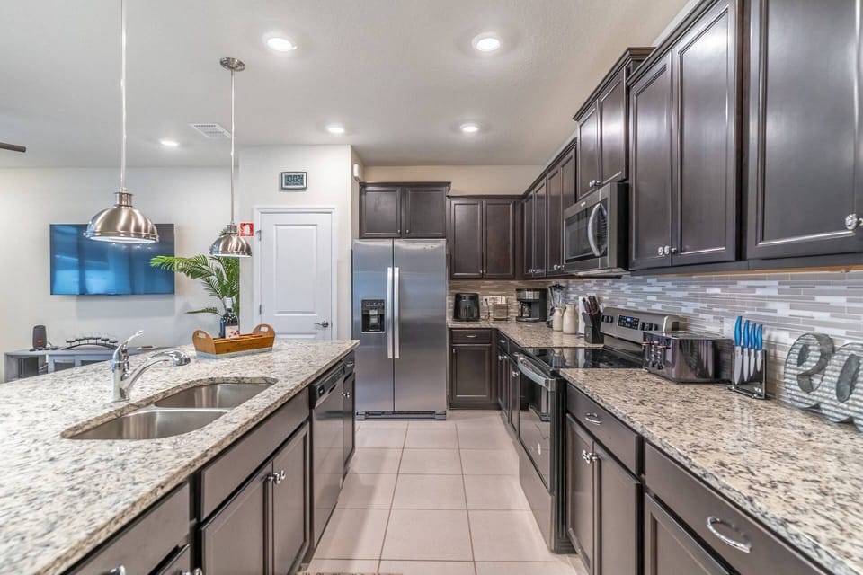 Updated and fully stocked Kitchen with Granite counters and stainless steel appliances