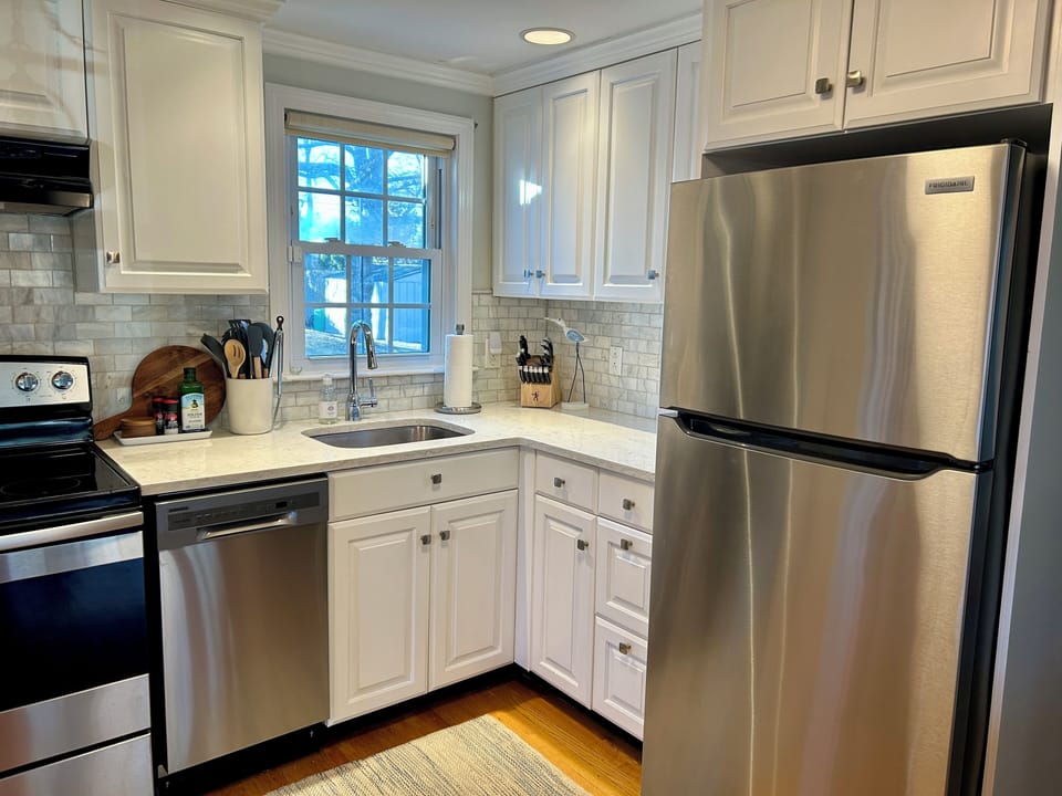 Updated kitchen, fully stocked with everything you need to cook.