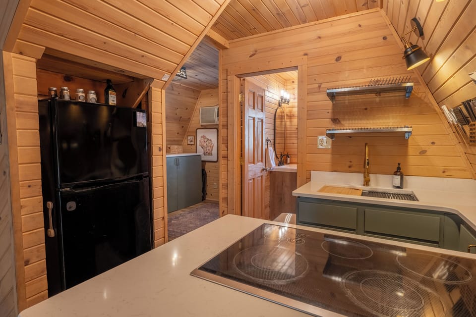 With a fridge, stove, and a workstation kitchen sink, this kitchen is ready for you.
