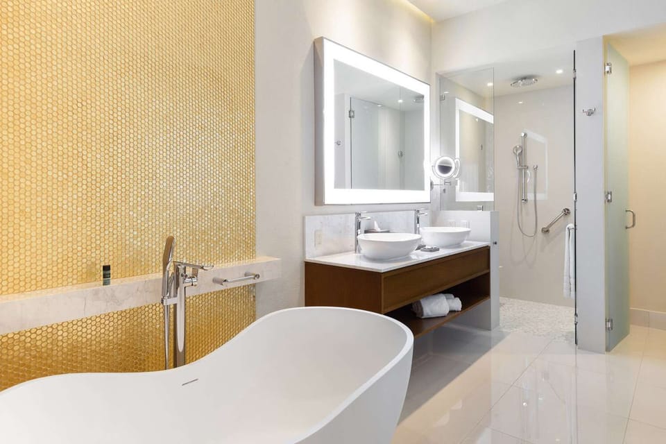 Soaking tub, duel vanity sink, privel toilet with bidet.