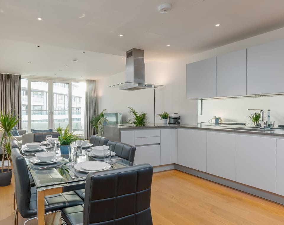 The table is close to the kitchen making it efficient for everyday use