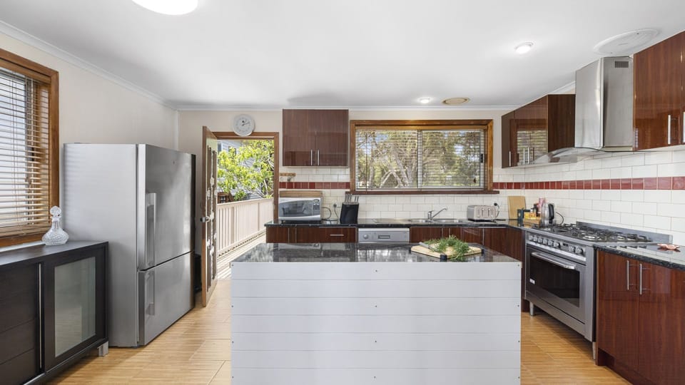 Large kitchen with stainless steel appliances
