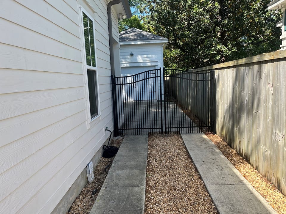 Privacy fence on 3 sides in backyard with gate access. 
