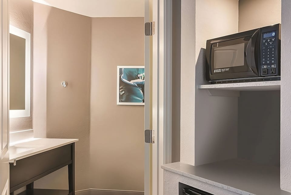 Enjoy handy microwave access and vanity space for easy mornings.