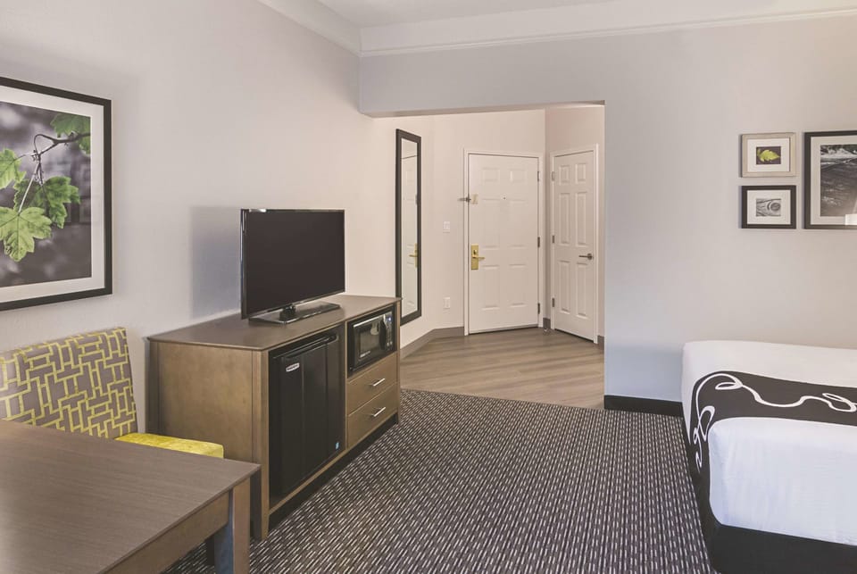 Unwind with in-room TV, fridge, and easy storage.