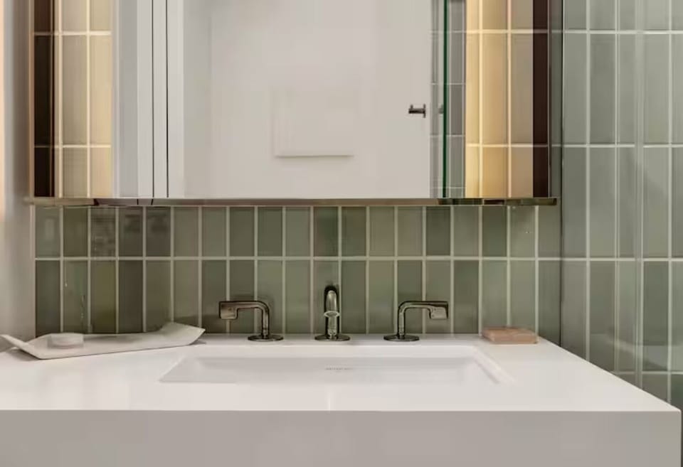 Settle in with spacious vanity lighting for an easy reset.